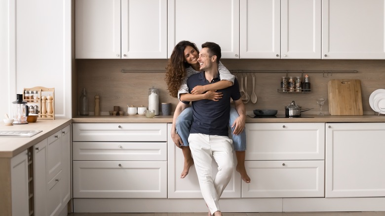 Couple next to kitchen countertop