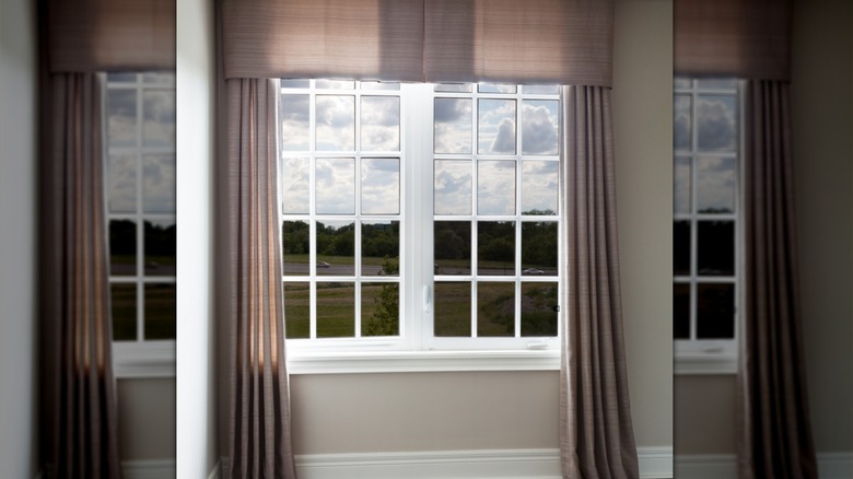 Valances hanging over floor-length curtains