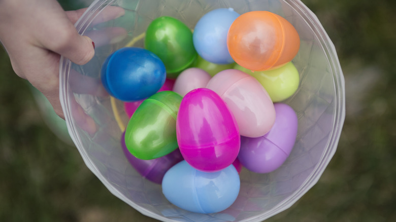 A bowl full of colorful plastic Easter eggs