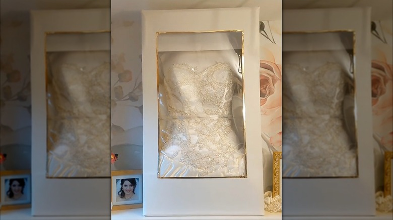 Wedding dress in a box on a shelf