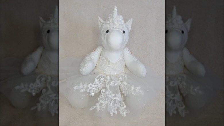 Stuffed unicorn wearing a wedding dress