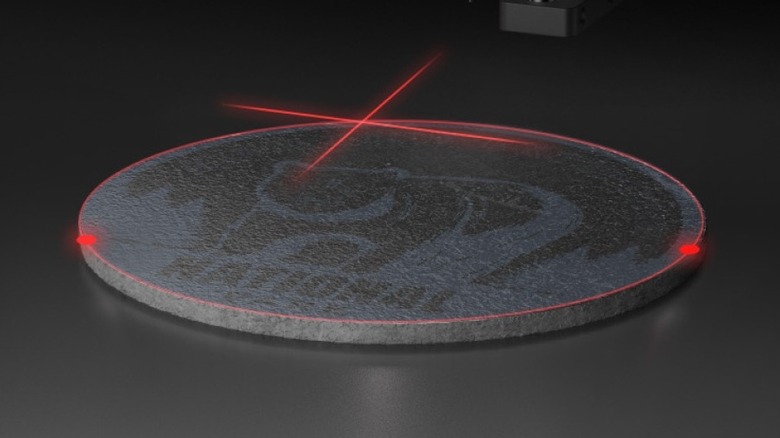 circular stone being engraved by laser