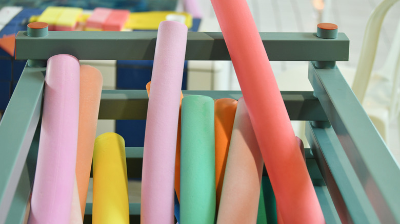 a collection of colorful pool noodles