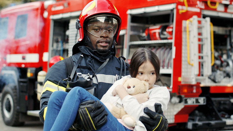 firefighter rescuing girl