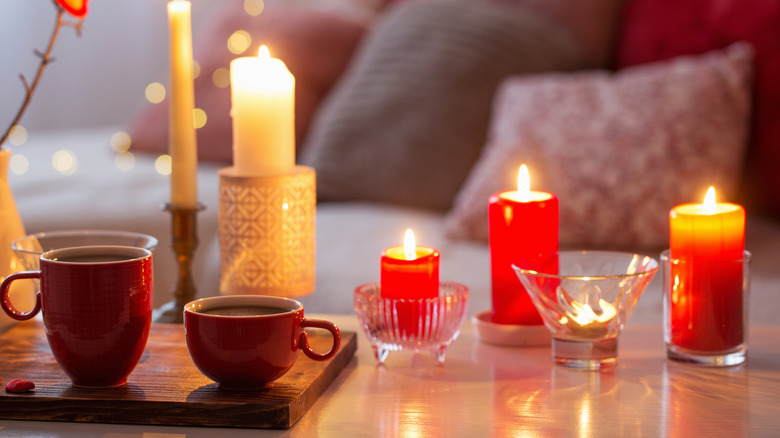 Candles burning on coffee table