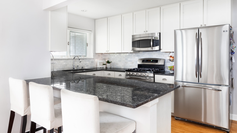 black countertops in white kitchen