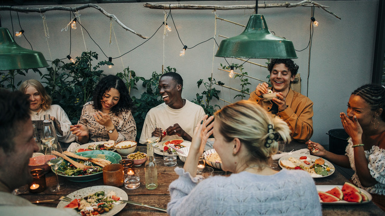 dinner party with string lights