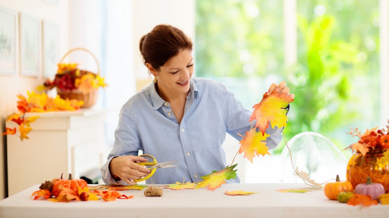 person completing fall crafts