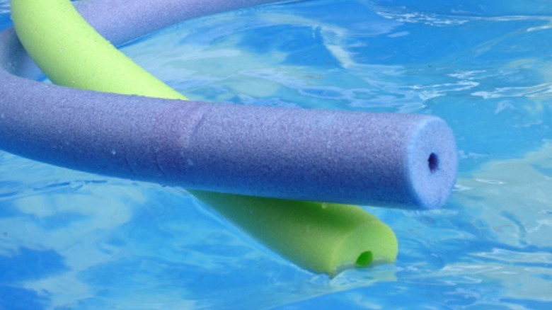 Hollow pool noodles in water