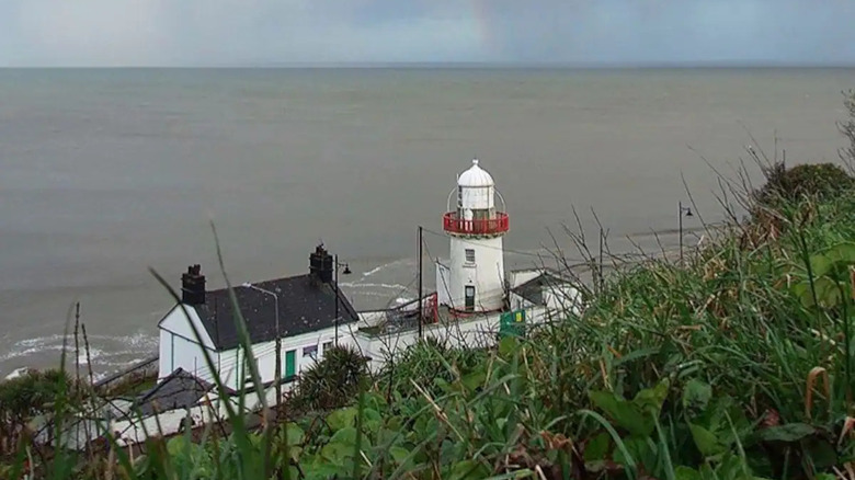 white lighthouse on coast