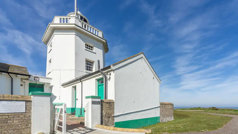 white and teal lighthouse