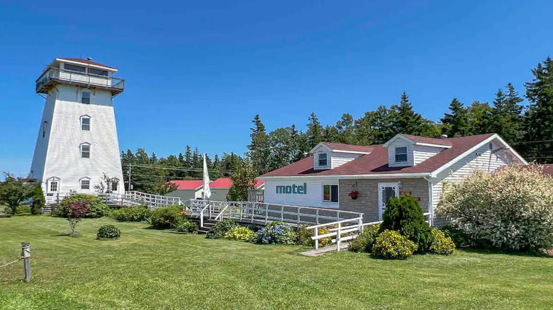 white lighthouse and motel