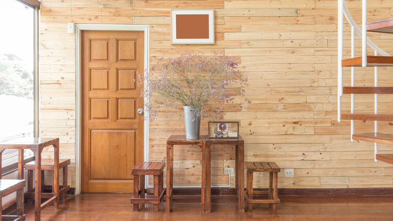 Reclaimed wooden wall with furniture