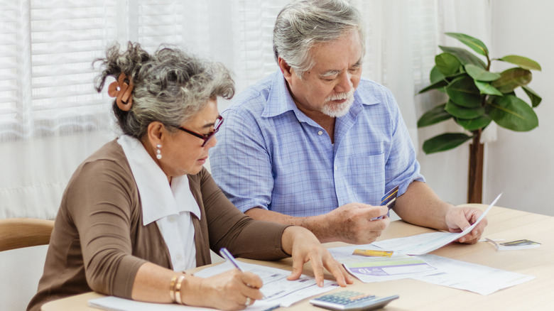 senior couple and paperwork