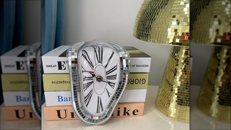 Melting clock on a stack of books