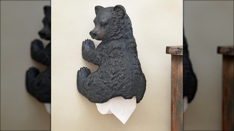 Bear cup toilet paper holder on the wall