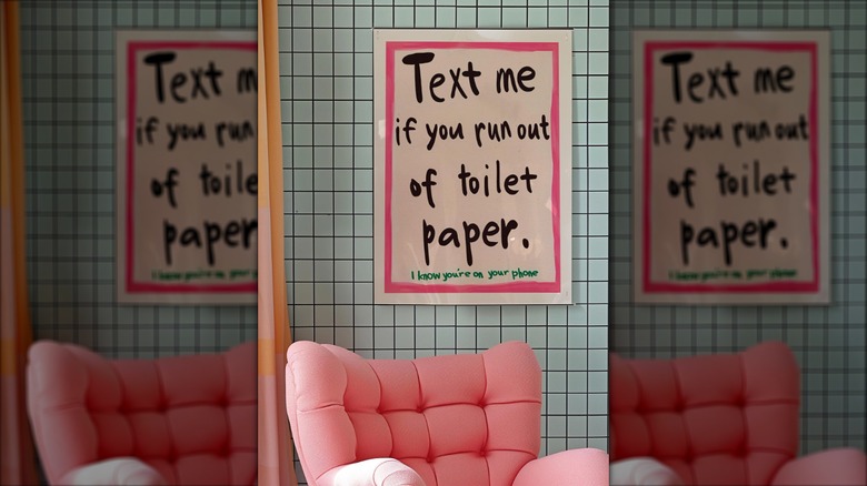 Humorous poster in a bathroom that says "text me if you run out of toilet paper. I know you're on your phone"