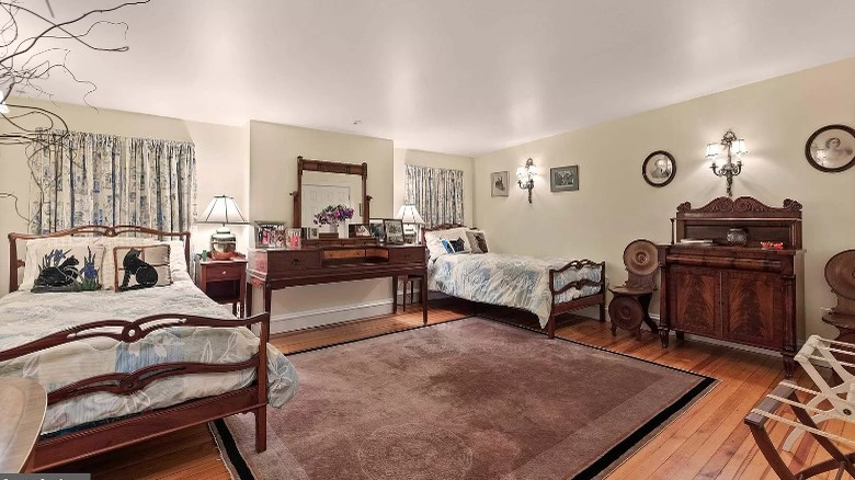 two full beds and antique furniture