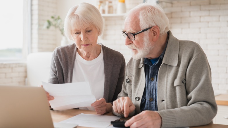 older couple looking over papers