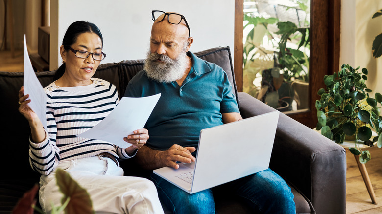 older couple looking at papers