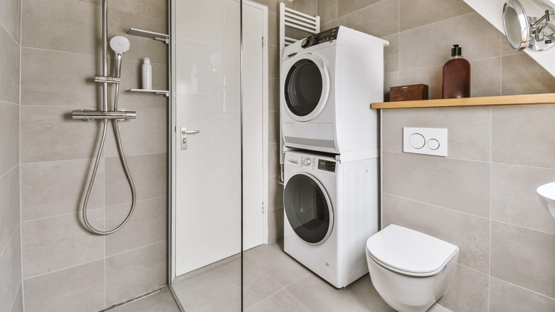 Bathroom with washer and dryer 