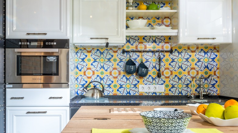 Kitchen with colorful tile backsplash