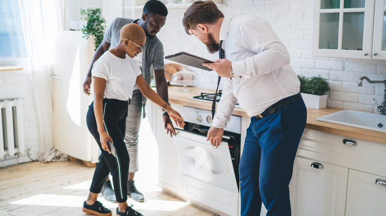 A couple inspecting a home