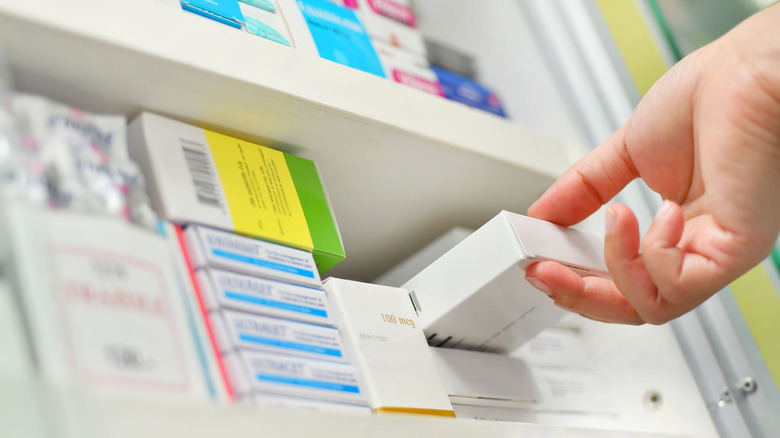 Boxes on pharmacy shelf