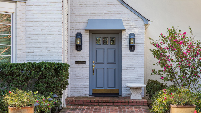 Blue door and white brick