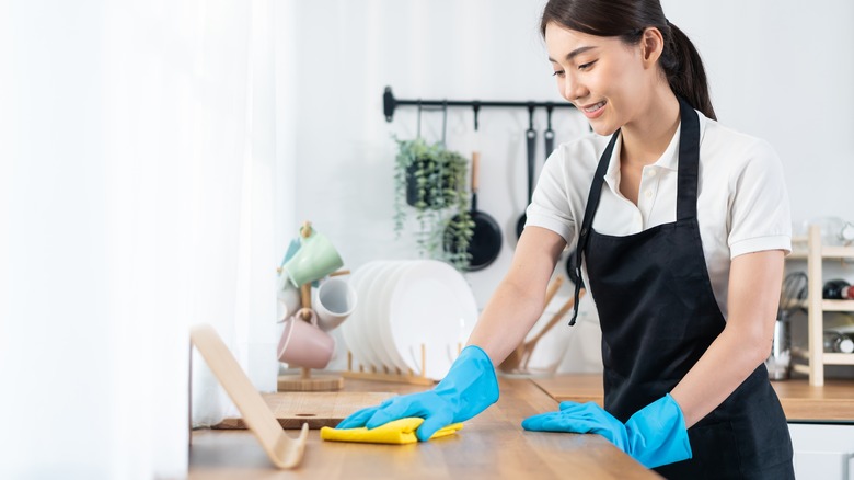 Person cleaning kitchen