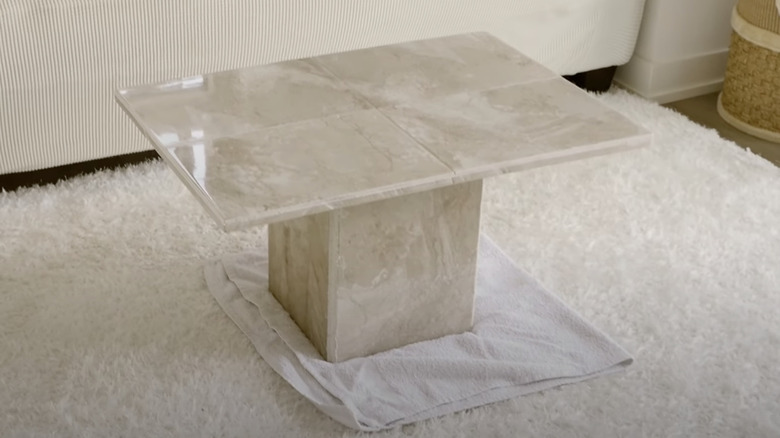 A DIY travertine coffee table in a living room