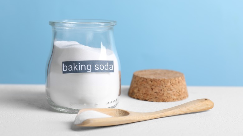 Baking soda with wooden spoon