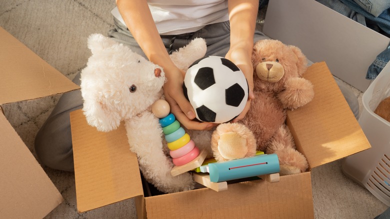 kids' toys in cardboard box