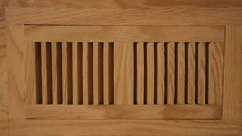 Close up shot of wooden floor vent