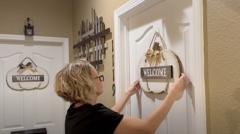 Hanging seasonal decor on interior doors