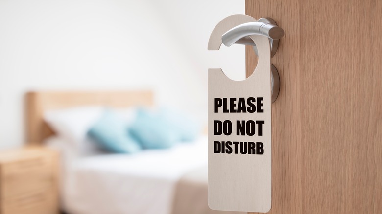 Bedroom door with sign