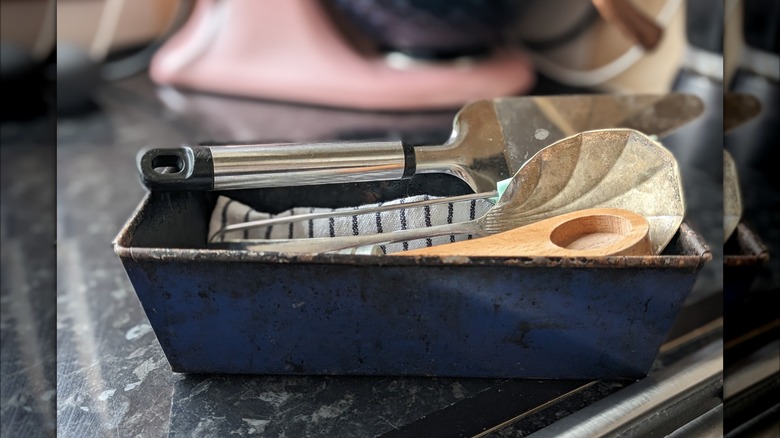 kitchen utensils in loaf tin