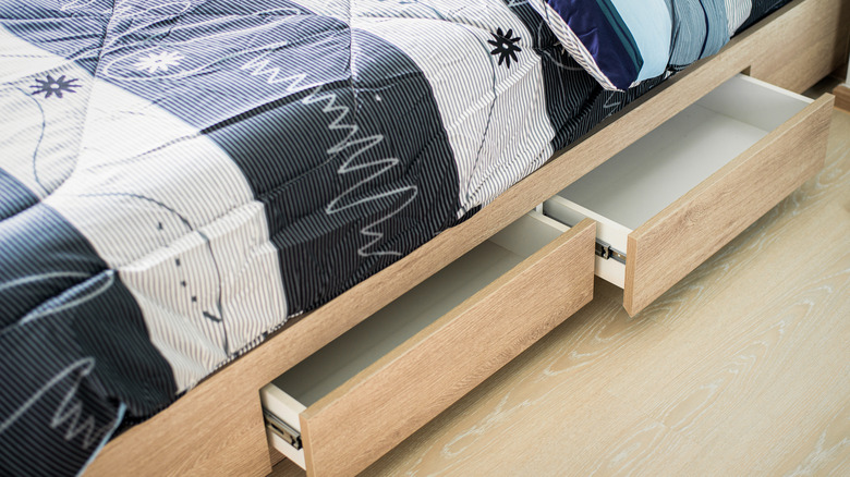 Bed with built-in storage drawer underneath