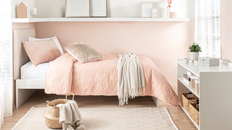 Baskets stored underneath bed frame