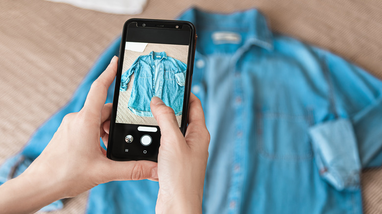 woman taking photo denim shirt