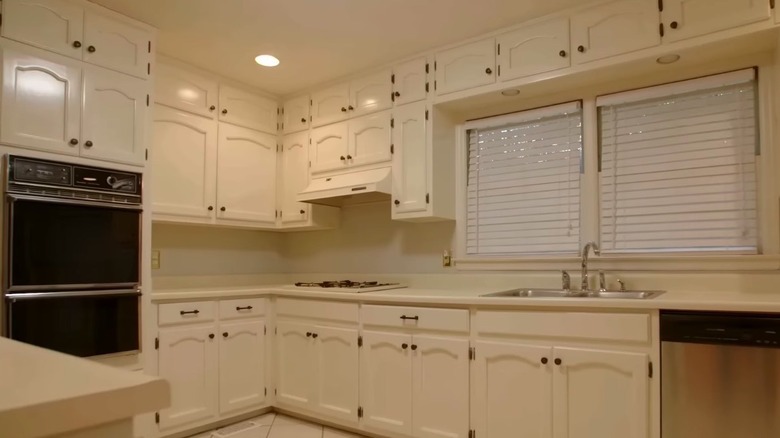 All-white kitchen with black hardware