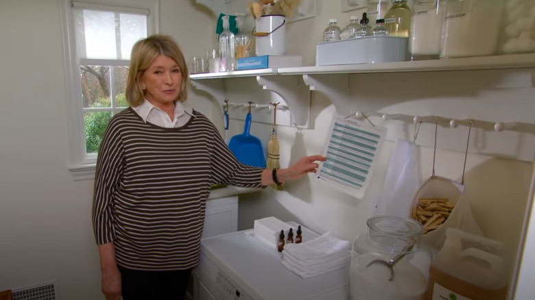 Martha Stewart holds a chart