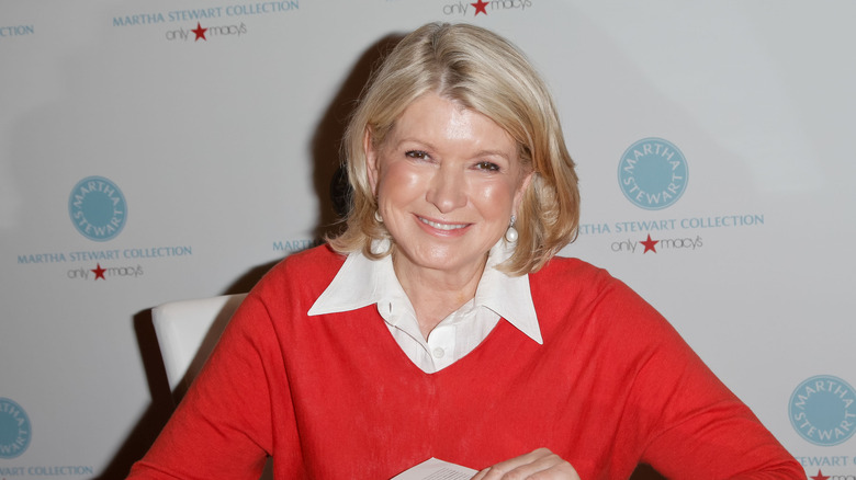 Martha Stewart smiling in a red sweater