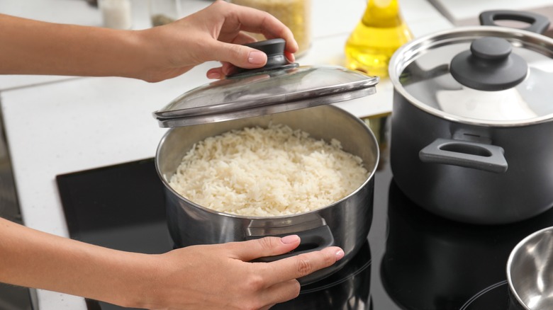 woman preparing white rice
