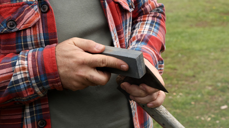 hand sharpening axe with whetstone