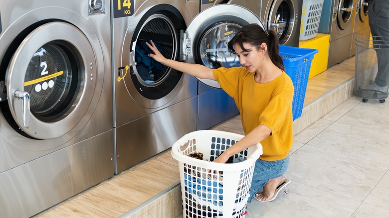 woman unloading washing machine