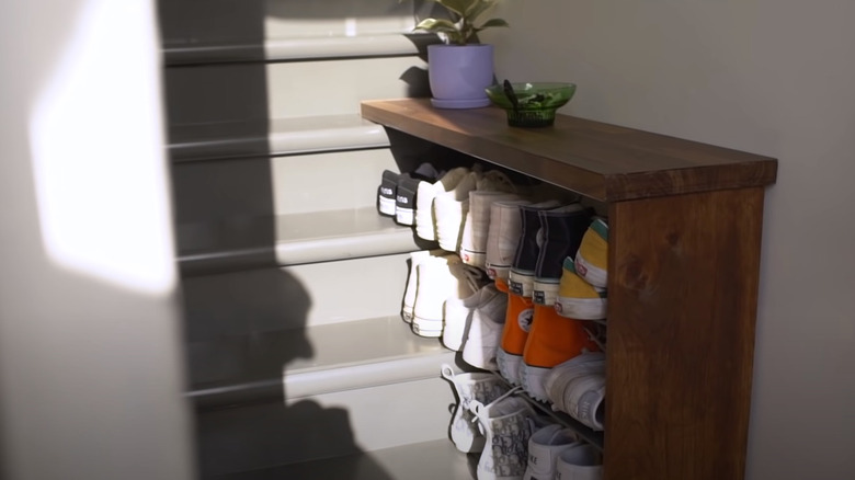 A DIY shoe rack filled with sneakers