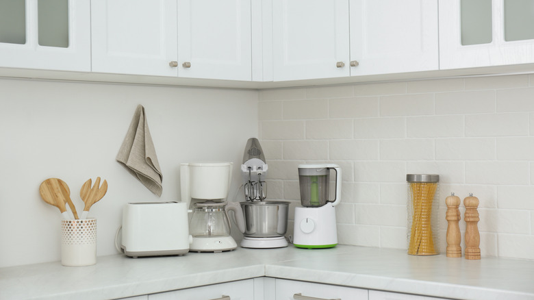 White kitchen with small appliances on the counter