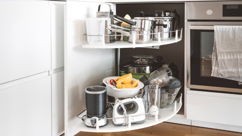 Cookware and small appliances in corner cabinet