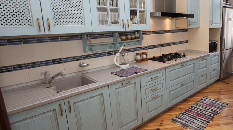 Small kitchen teal cabinets